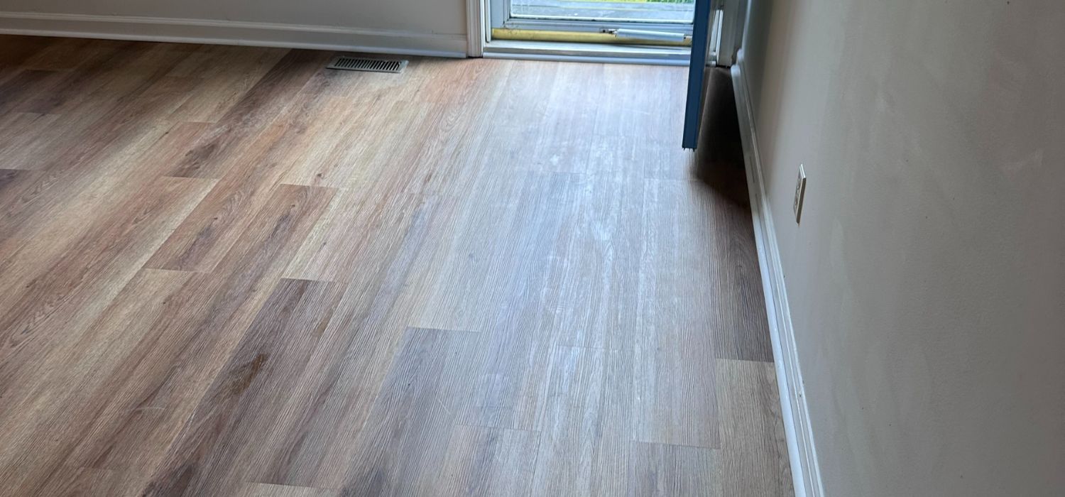 Luxury vinyl plank flooring installed in a Gasburg, VA home, showing a clean, seamless finish that enhances durability, appearance, and home value.